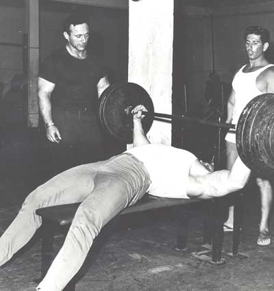 bench pressing in the Dungeon gym